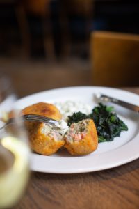 0069 - 2021 - Quod Restaurant & Bar - Oxford - High Res - Indoor Dining Food Fishcakes Spinach - Web Feature