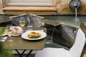 A7R00926 - 2023 - Quod Restaurant & Bar - Oxford - High Res - Italian Garden Terrace Fountain Food Halibut Fish White Wine - Web Hero