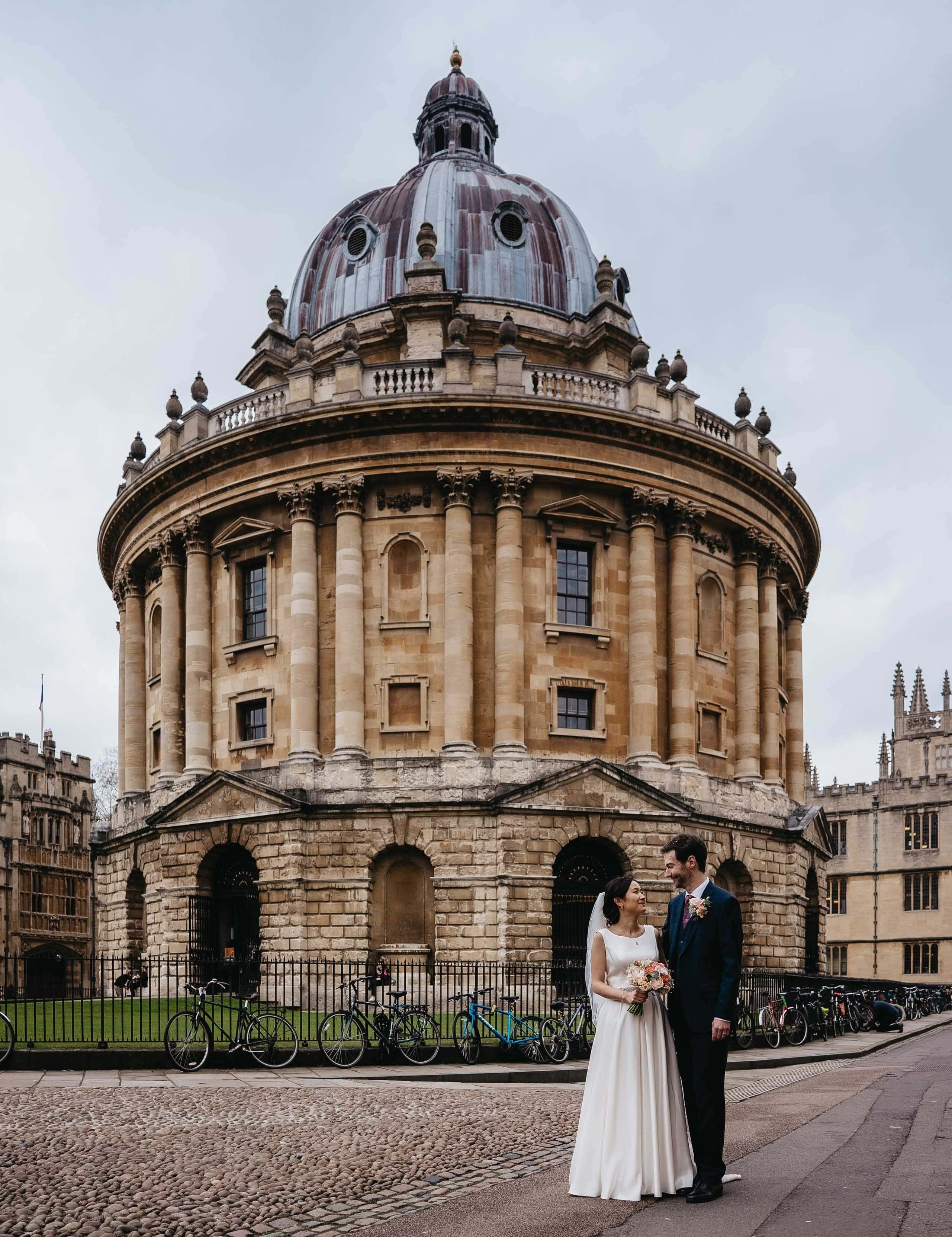 ConnieAndrewcolour-196-2022-Radcliffe-Square-Oxford-High-Res-Wedding-Couple-Guests-Friends-Family-Web-Hero-aspect-ratio-2560-3324